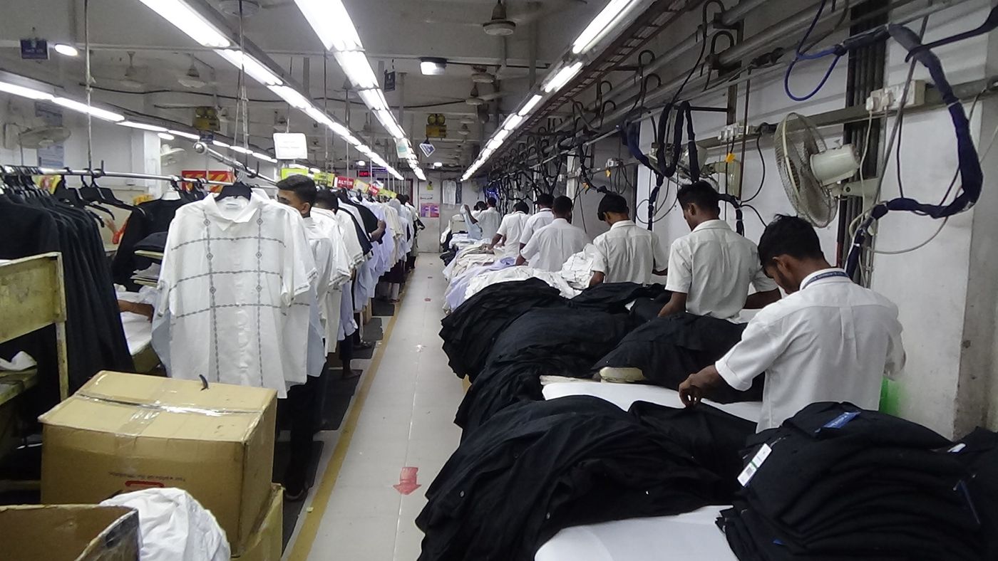 Finishing section with garments on inspection tables