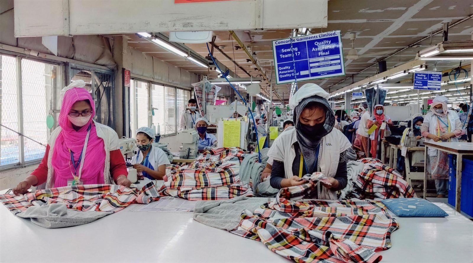 Operators sewing check shirts at Concorde Garments